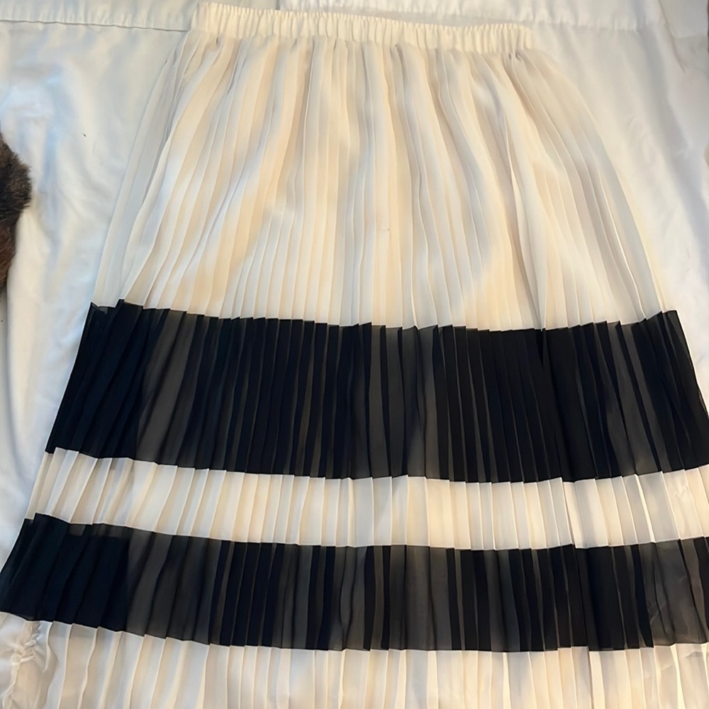 Cute, knee length skirt. Ivory and black striped.